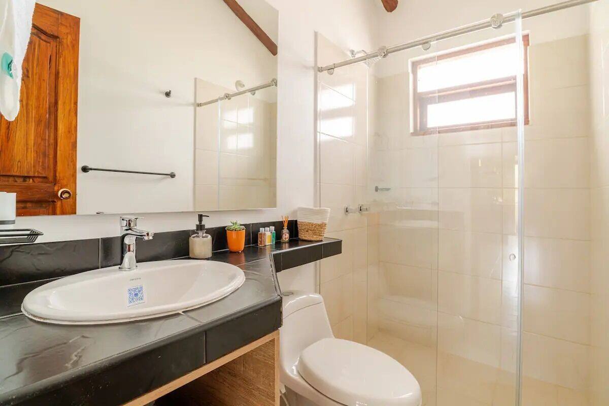 Shower, rainfall showerhead, towels, soap