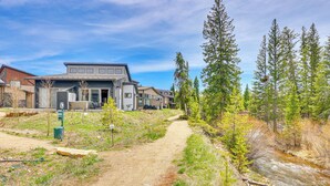 A residential area with a dirt path leading to houses, surrounded by trees and a small stream. - Walk to Dtwn: Fraser Retreat w/ Hot Tub & Views! (Fraser)