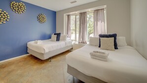 A hotel room with two beds, a large window with curtains, and decorative wall art. - Red Rock State Park Views: Sedona Home w/ Fire Pit (Sedona)