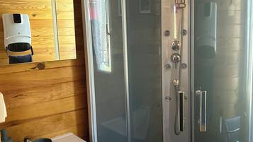 Shower, hair dryer, towels, toilet paper