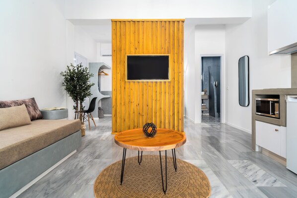 Superior Studio | Living area | 55-inch Smart TV with satellite channels - Oliva Apartments (Santorini)