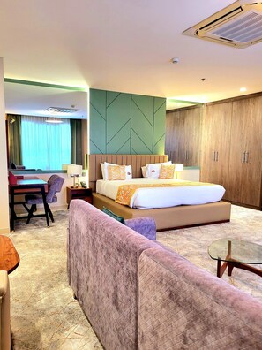 In-room safe, desk, laptop workspace, soundproofing - Kingjada Hotel  (Dar es Salaam)