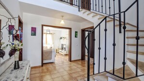 A staircase with wooden steps and black metal railings, leading to an upper floor. - Holiday Home 'Ines' with Mountain View, Wi-Fi and Air Conditioning (Inca)