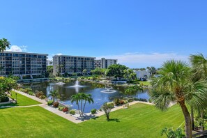 Stroll through the serene courtyard, surrounded by lush greenery and a tranquil pond with a soothing fountain.