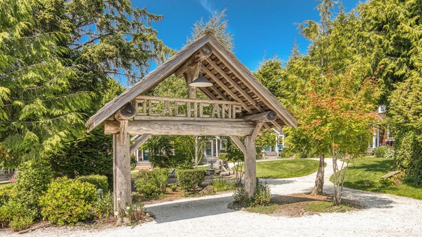 A wooden gazebo with the inscription "BEACH CAMP" and the year "2009". - Seabrook Cabin - Private HotTub & Backyard, 10 minute Walk to Town, Dog Friendly (Pacific Beach)