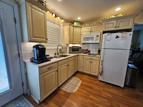 Sam's Place.  UPDATED LISTING!  Relax in the hot tub after a day of golf!