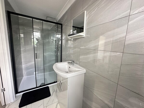 Shower, hair dryer, towels, soap