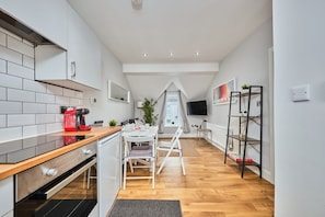 Enjoy meals in the kitchen with a dining area offering a view of the outside.