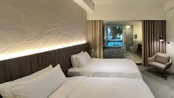 Premium bedding, down comforters, free minibar, in-room safe
