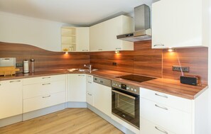 Fridge, stovetop, dishwasher, coffee/tea maker