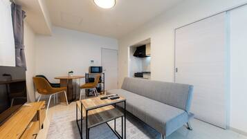 Basic Apartment | Living area | Flat-screen TV