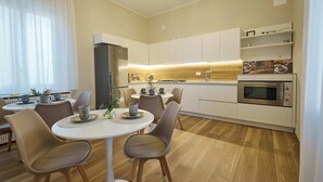Mini-fridge, microwave, cookware/dishes/utensils