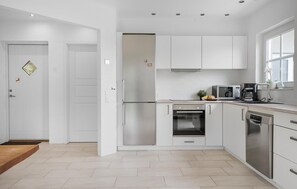 Fridge, stovetop, dishwasher, coffee/tea maker