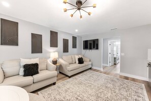 Smart TV, fireplace, books, offices