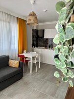 Comfort Condo | Living area | 32-inch Smart TV with satellite channels