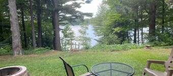 Cozy waterfront sunset cottage on Herendeene Lake in Lake Ann, Dock, Dog ok