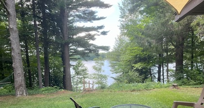 Cozy waterfront sunset cottage on Herendeene Lake in Lake Ann, Dock, Dog ok