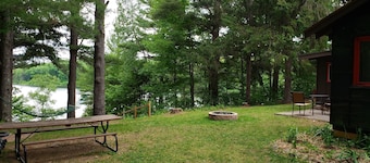 Cozy waterfront sunset cottage on Herendeene Lake in Lake Ann, Dock, Dog ok
