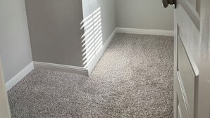 A corner of a room with a grey textured wall, a white door, and a white ceiling. - Furnished clean newly room. No pet, smoking or party (Jarrell)