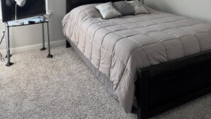 A bedroom with a bed, a bedside table, a lamp, and a ceiling light fixture. - Furnished clean newly room. No pet, smoking or party (Jarrell)