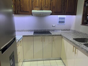 Fridge, microwave, stovetop, coffee/tea maker