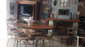 TV, fireplace, books