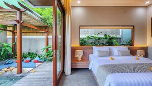 A modern bedroom with a large bed, bedside lamps, a large mirror, and a view of greenery outside.