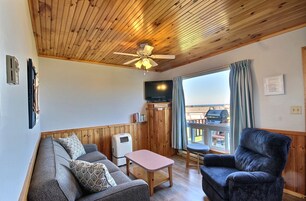 Deluxe Cottage | Living area | 24-inch flat-screen TV with premium channels