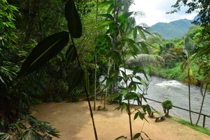 Deluxe Room, River View | Living area | TV