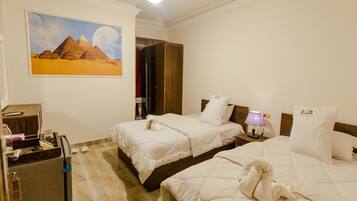 Quarto clássico | 1 quarto, frigobar, Wi-Fi de cortesia, roupa de cama