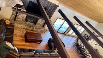 Smart TV, fireplace, table football, books