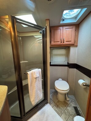 Shower, hair dryer, towels, soap