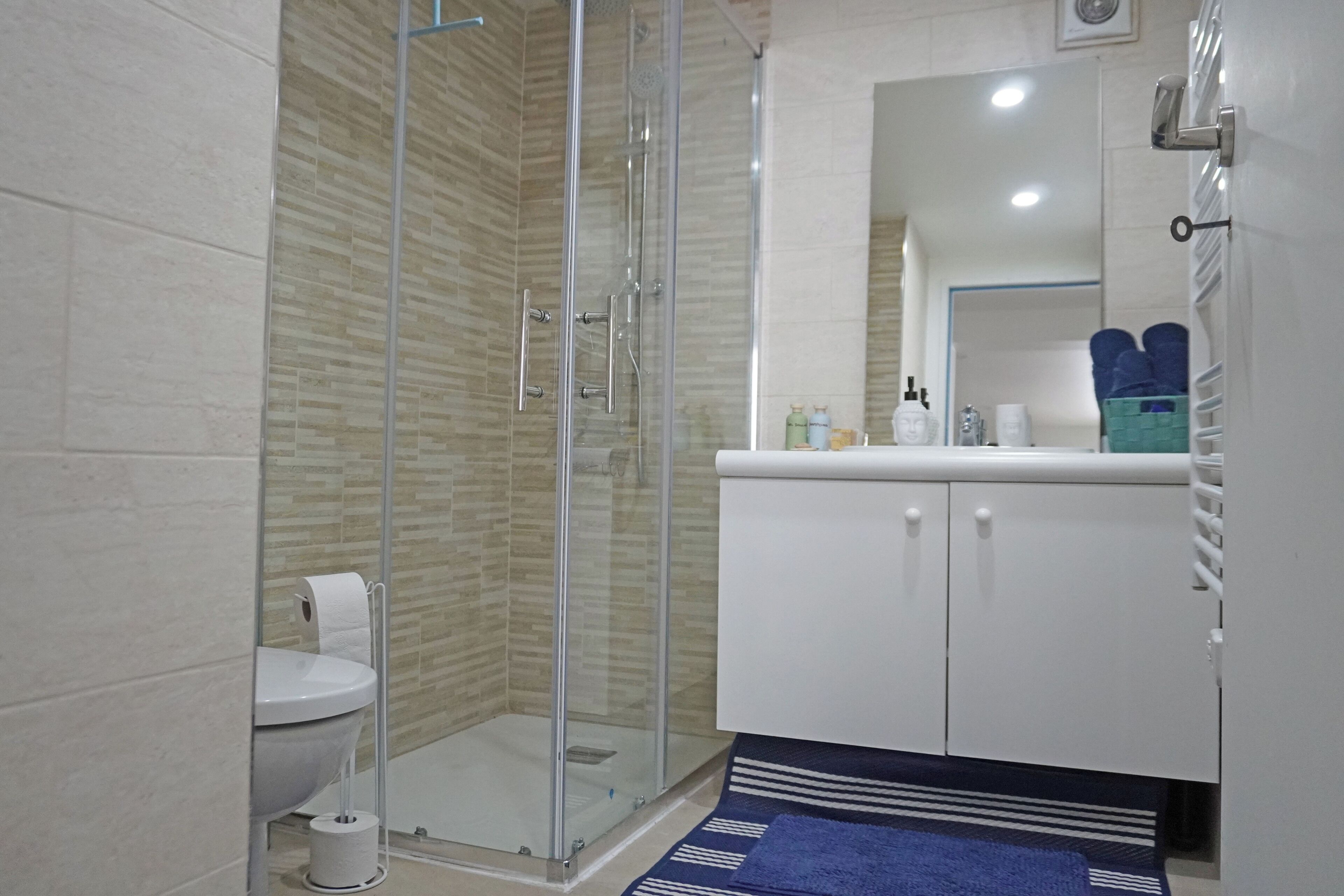 Shower, hair dryer, towels, soap