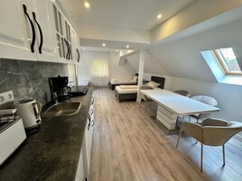 Quadruple Room, Kitchen | Living area | Smart TV
