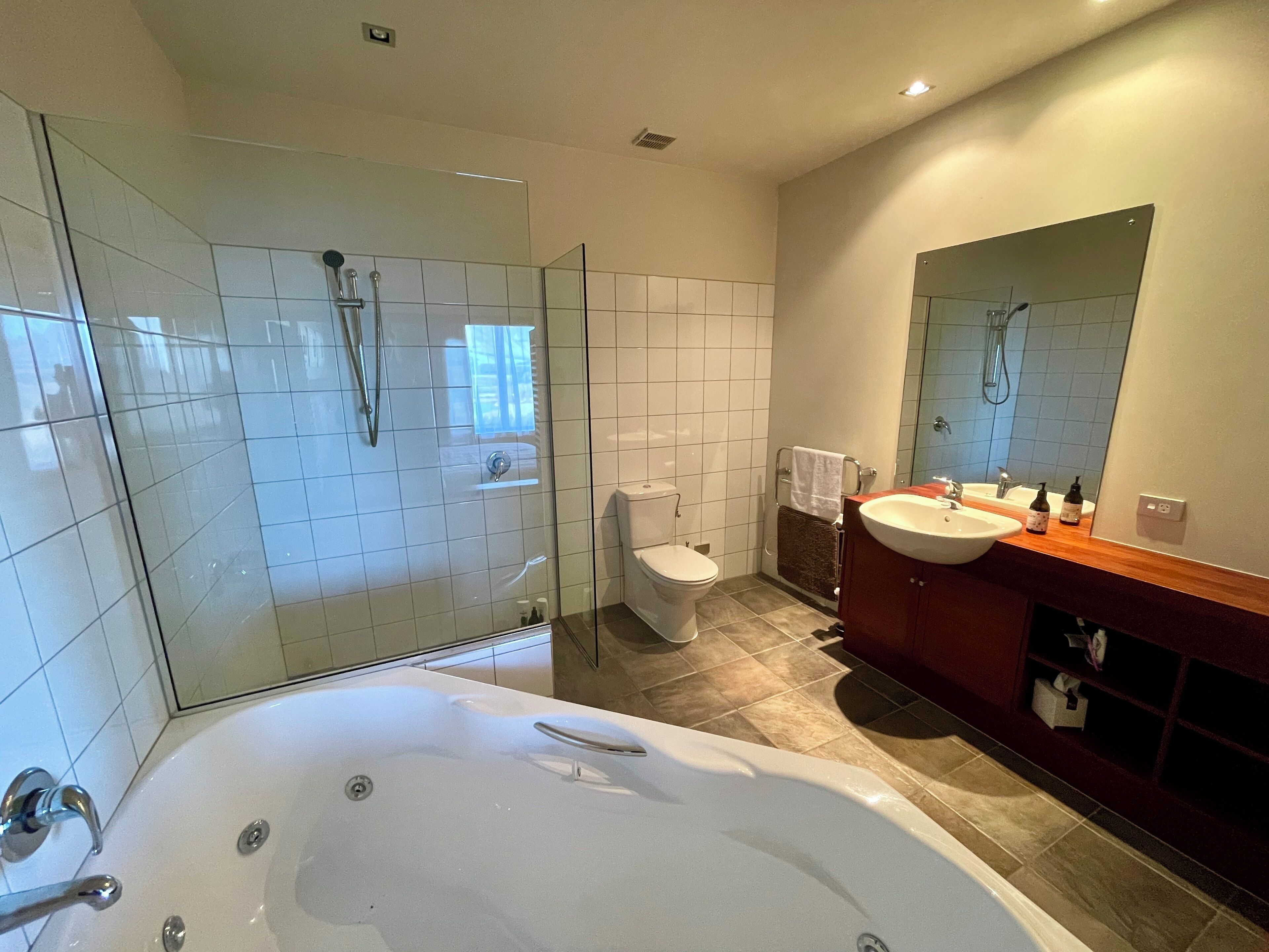 Shower, jetted bath, towels, soap