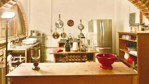 A kitchen with an arched brick ceiling, stainless steel appliances, and various kitchen utensils. - Room #1 two blocks from the Malecon (La Paz)