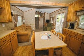 Living area - Whispering Pines. 1BR +loft, w/ queen hide-a-bed. Lake view, beach access. (Richmond)