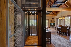 Relax in a spacious room with a dining area, television, and large windows.