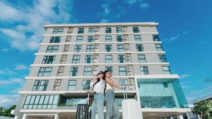 A multi-story hotel with a modern design, featuring a large glass facade and a series of balconies. - B2 Khon Kaen Wufoo Market Premier Hotel (Khon Kaen)