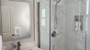 Shower, hair dryer, towels, soap