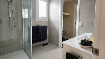 Shower, hair dryer, towels, soap