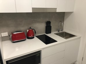 Fridge, microwave, toaster, cookware/dishes/utensils