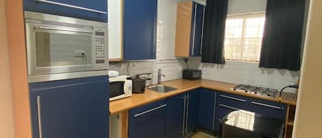 Fridge, microwave, coffee/tea maker, toaster