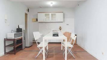 Family Apartment, 2 Bedrooms, Balcony, City View | Private kitchen | Stovetop, electric kettle, rice cooker, griddle