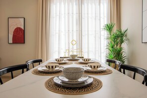 Luxury Apartment A6 - Modern | Living area | TV - Amber Hospitality Izdihar (Riyadh)
