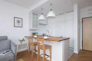 Apartment, 1 Bedroom, Balcony | Private kitchen | Oven, dishwasher, electric kettle, cookware/dishes/utensils - Bright Apartment for 3 People by Renters (Warsaw)
