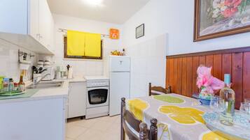 Apartment (One-Bedroom Apartment with Terrace (A) | Private kitchen | Fridge