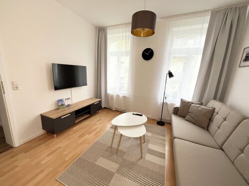 Apartment Mitten in der Stadt mit Garten und Grill