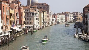 A canal in Venice with historic buildings lining the waterway.