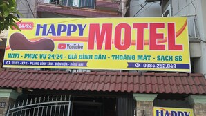 A motel with a prominent sign advertising 24/7 WiFi, YouTube, and a contact number. - Happy Motel (Bien Hoa)